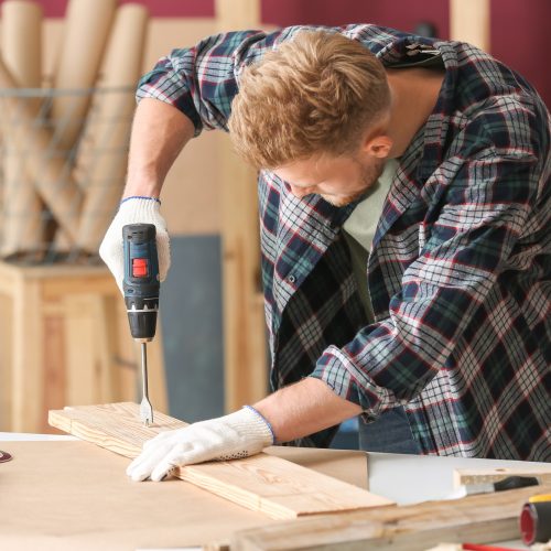 Male carpenter working in shop Male carpenter working in shop