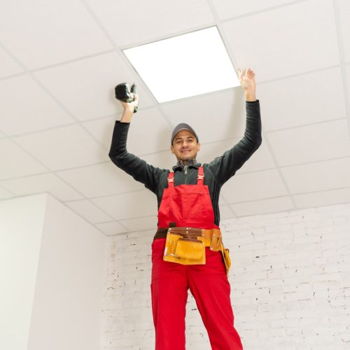 Ceiling installation with expert technicians In the room that is in the construction process. Ceiling installation with expert technicians In the room that is in the construction process